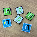 Металлические значки с логотипом Leroy Merlin